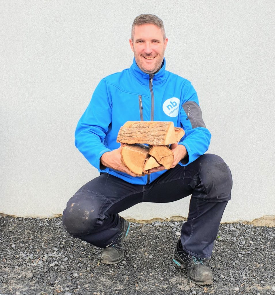 Eamon holding some kiln dried firewood blocks › nobother.ie